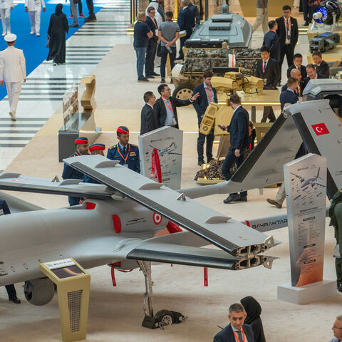 Visitors view a Bayraktar TB3 Armed Unmanned Aerial System on display at the UMEX Exhibition showcasing drones, robotics, and unmanned sytems at the Abu Dhabi National Exhibition Centre in Abu Dhabi on January 23, 2024. (Photo by Ryan LIM / AFP) (Photo by RYAN LIM/AFP via Getty Images)