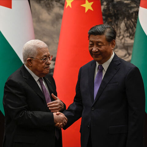 Palestinian President Mahmud Abbas shakes hands with China's President Xi Jinping after a signing ceremony at the Great Hall of the People in Beijing on June 14, 2023. (Photo by Jade GAO / POOL / AFP) (Photo by JADE GAO/POOL/AFP via Getty Images)