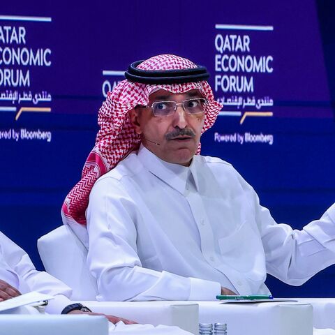 Qatar's Finance Minister Ali bin Ahmed Al Kuwari (L) listens as his Saudi counterpart Mohammed Al-Jadaan speaks during a session at the Qatar Economic Forum in Doha on May 14, 2024. 