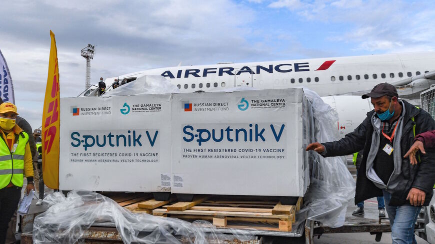 This picture taken on March 9, 2021 shows the arrival of a shipment of Russia's Sputnik V COVID-19 coronavirus vaccines in Tunisia's capital's Tunis-Carthage International Airport. 