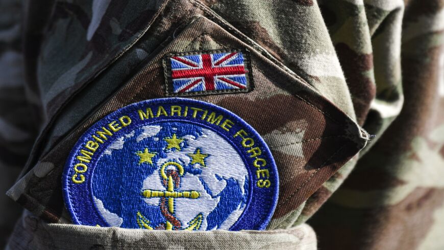 This picture taken on Nov. 5, 2019, during the International Maritime Exercise (IMX) in the Gulf waters off Bahrain shows a close-up of the badge of the Combined Maritime Forces (CMF) multinational naval partnership worn on the uniform of a British serviceman.
