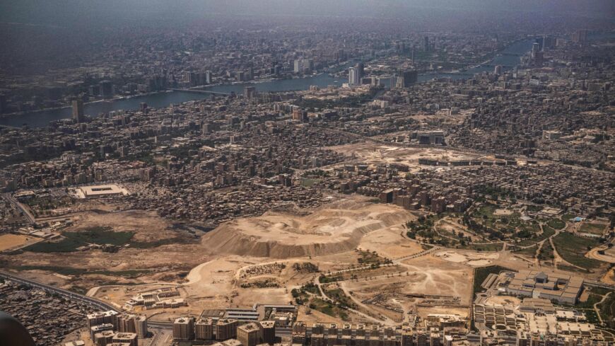 This picture taken on May 14, 2021, shows an aerial view of Egypt's capital Cairo's Nile island of Manial al-Roda (top) and the historic old Cairo district (bottom).