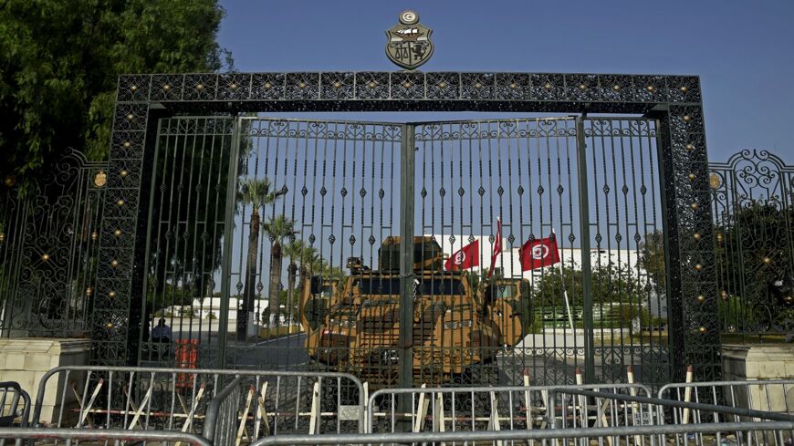 The Tunisian army barricades the parliament building in the capital, Tunis, on July 26, 2021, after the president dismissed the prime minister and ordered parliament closed for 30 days.