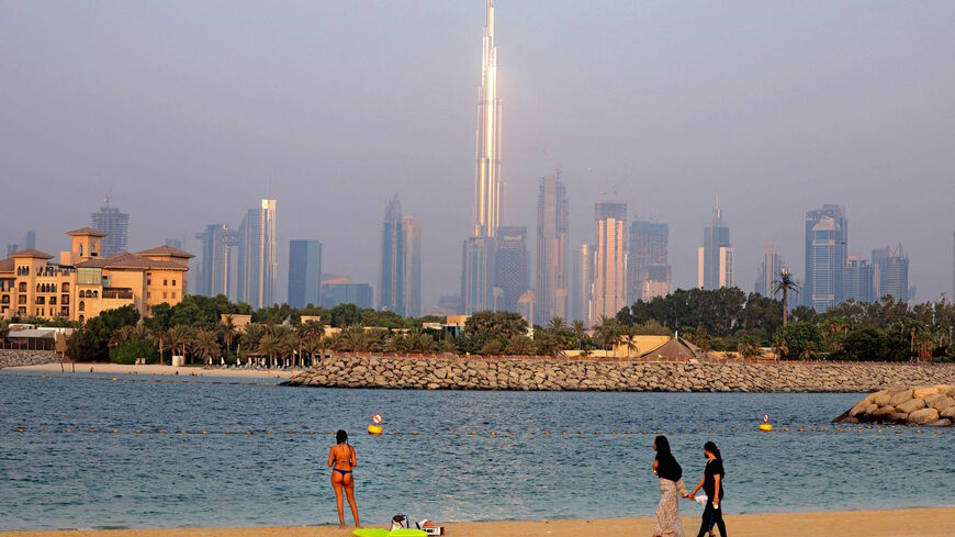 Emirati women look at a tourist in Dubai's Jumeirah Beach Residence on Aug. 17, 2021.
