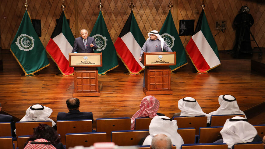 Arab League Secretary-General Ahmed Aboul Gheit (L) gives a statement while accompanied by Kuwait's Foreign Minister Sheikh Ahmed Nasser Al-Mohammed Al-Sabah during a meeting of the foreign ministers of the Arab League state, Kuwait City, Kuwait, Jan. 30, 2022.