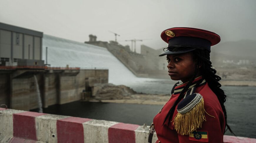 A member of the Republican March Band poses for a photo at the ceremony for the inaugural production of energy at the Grand Ethiopian Renaissance Dam.