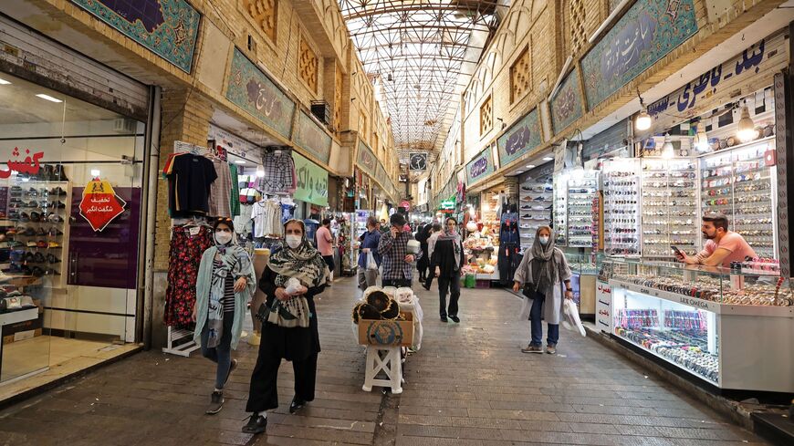 Iranian women shop at the Tajrish traditional bazaar in the capital Tehran on Oct. 2, 2022. This week many Iranian business owners across the country have closed their doors as part of a widespread strike.