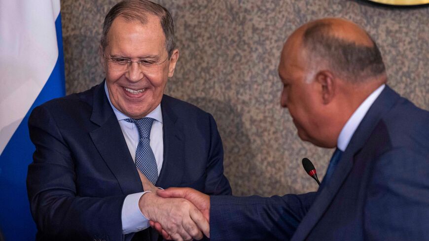 Egyptian Foreign Minister Sameh Shokry (R) and his Russian counterpart Sergei Lavrov shake hands during a joint press conference in the capital Cairo, on July 24, 2022. - Russia's top diplomat will address the Arab League at its Cairo headquarters, the organisation said, days after Russia took part in a summit hosted by Iran, a regional rival of some Arab states.  (Photo by KHALED DESOUKI/AFP via Getty Images)