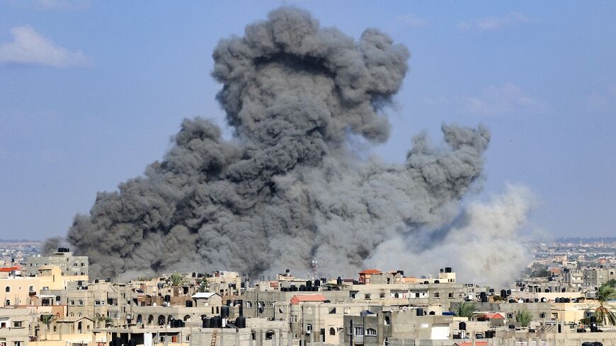 Smoke billows during an Israeli air strike in Rafah in the southern Gaza Strip on October 11, 2023