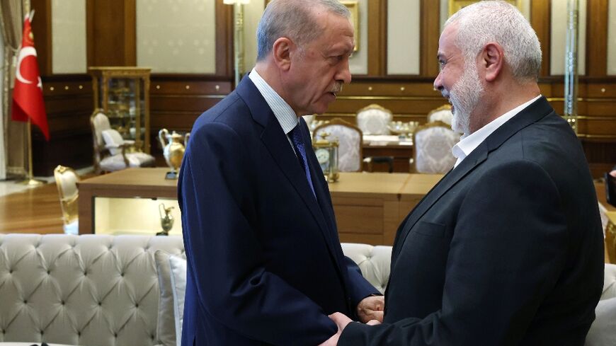 Turkish President Recep Tayyip Erdogan (L) met Hamas chief Ismail Haniyeh in July