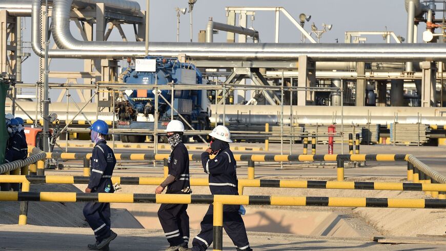 Employees of Aramco oil company work in Saudi Arabia's Abqaiq oil processing plant on September 20, 2019. - Saudi Arabia said on September 17 its oil output will return to normal by the end of September, seeking to soothe rattled energy markets after attacks on two instillations that slashed its production by half. The strikes on Abqaiq - the world's largest oil processing facility - and the Khurais oil field in eastern Saudi Arabia roiled energy markets and revived fears of a conflict in the tinderbox Gulf