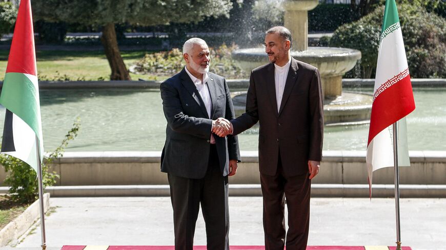 Iran's Foreign Minister Hossein Amir-Abdollahian (R) receives Hamas' Doha-based political bureau chief Ismail Haniyeh.