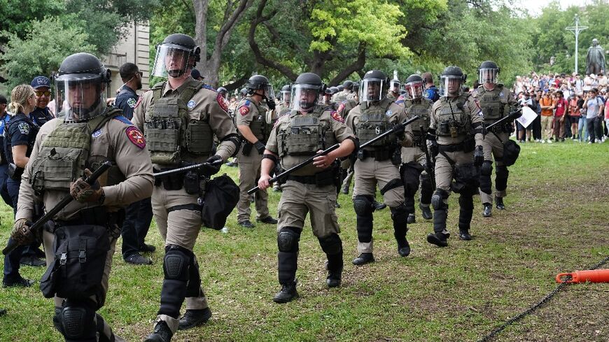 Texas state troopers walk on the campus of the University of Texas as pro-Palestinian students protest the Israel-Hamas war in Austin on April 24, 2024