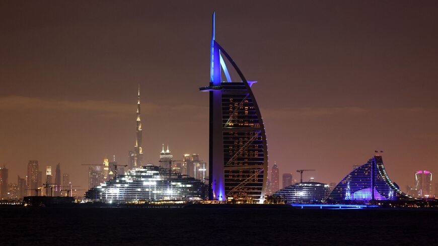 A picture taken on January 23, 2022, shows the skyline of the Emirate of Dubai with Burj Al Arab (C) and Burj Khalifa (background-L). (Photo by Giuseppe CACACE / AFP) (Photo by GIUSEPPE CACACE/AFP via Getty Images)