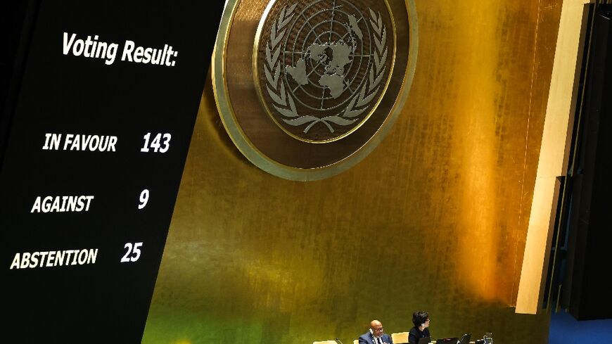 The results of a vote on a resolution for the UN Security Council to reconsider and support the full membership of Palestine into the United Nations is displayed during a special session of the UN General Assembly