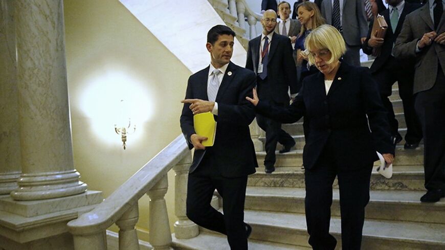 Senate Budget Committee chairman Senator Patty Murray (D-WA) (R) and House Budget Committee chairman Representative Paul Ryan (R-WI) (L) depart after a news conference to introduce The Bipartisan Budget Act of 2013 at the U.S. Capitol in Washington, December 10, 2013. Budget negotiators in the U.S. Congress have reached an agreement on Tuesday that, if approved by the House and Senate, could restore some order to the nation's chaotic budget process and avoid another government shutdown on Jan. 15.  REUTERS/