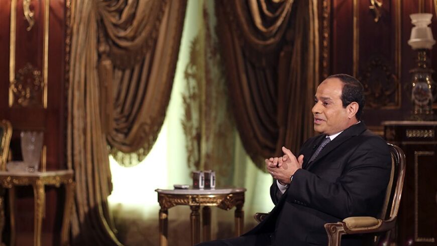 Egypt's presidential candidate and former army chief Abdel Fattah al-Sisi, speaks during an interview with Reuters in Cairo May 14, 2014. Abdel Fattah al-Sisi, the general who ousted an elected Islamist president and is set to become Egypt's next head of state, called on the United States to help fight jihadi terrorism to avoid the creation of new Afghanistans in the Middle East. Picture taken May 14, 2014. REUTERS/Amr Abdallah Dalsh  (EGYPT - Tags: POLITICS ELECTIONS MILITARY) - RTR3P9BN