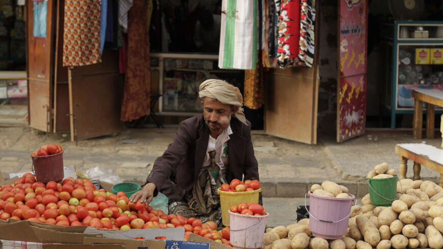 A street vendor chews qat, a mild stimulant, as he sits by his vegetable stall at a market place in the Old Sanaa city March 19, 2014. Qat dominates life in Yemen, where most men spend half the day chewing it, even at work, and experts say it is ravaging Yemen's frail economy and sucking up precious water. REUTERS/Khaled Abdullah (YEMEN - Tags: SOCIETY ENVIRONMENT) - RTR3HSAZ