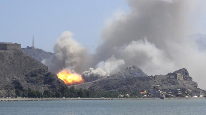 An arms depot explodes at the Jabal Hadeed military compound in Yemen's southern port city of Aden March 28, 2015. Explosions rocked Aden's largest arms depot on Saturday, sending flames and smoke into the sky above the southern Yemeni city, witnesses said. A Reuters correspondent saw fire and explosions at the Jabal Hadeed compound, which is close to residential and commercial properties. There was no immediate word of casualties. REUTERS/Nabeel Quaiti      TPX IMAGES OF THE DAY      - RTR4V93W