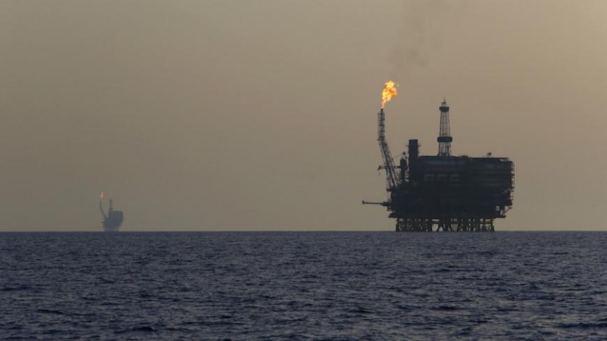 Offshore oil platforms are seen at the Bouri Oil Field off the coast of Libya August 3, 2015. Oil prices lurched 5 percent lower on Monday to their lowest since January, taking global benchmark Brent below $50 a barrel as weak factory activity in China deepened a commodity-wide rout. REUTERS/Darrin Zammit Lupi MALTA OUT. NO COMMERCIAL OR EDITORIAL SALES IN MALTA - RTX1MWTJ