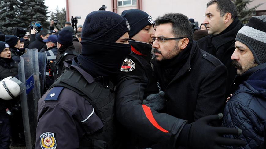 Riot police scuffle with protesters trying to march to the Turkish Parliament as the lawmakers gather to debate the proposed constitutional changes in Ankara, Turkey, January 9, 2017. REUTERS/Umit Bektas - RTX2Y3PK