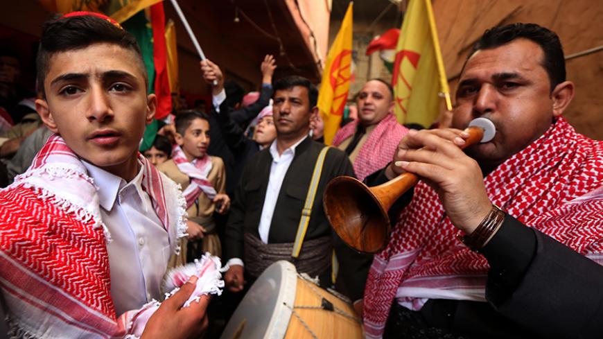 Iraqi Kurds play music as they walk through the town of Akra, 500 km north of Baghdad, on March 20, 2017 as they celebrate the Noruz spring festival. 
The Persian New Year is an ancient Zoroastrian tradition celebrated by Iranians and Kurds which coincides with the vernal (spring) equinox and is calculated by the solar calender.  / AFP PHOTO / SAFIN HAMED        (Photo credit should read SAFIN HAMED/AFP/Getty Images)