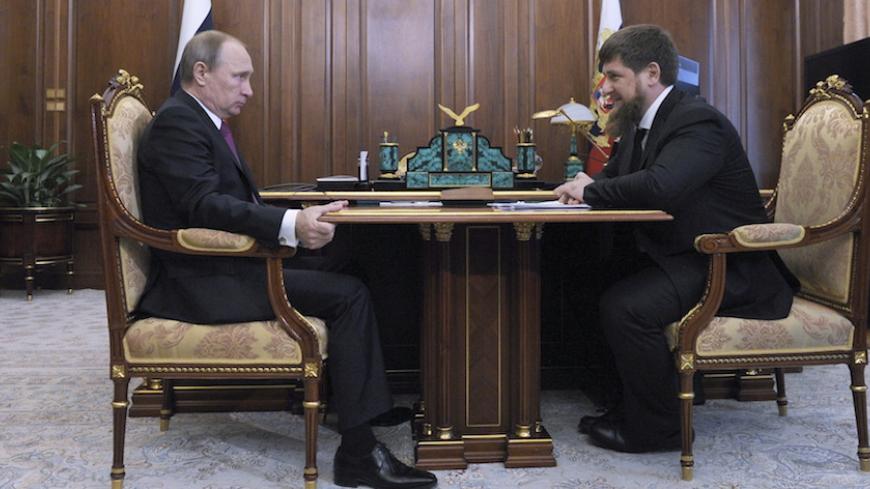 Russian President Vladimir Putin (L) meets with Chechnya's leader Ramzan Kadyrov at the Kremlin in Moscow, Russia, March 25, 2016. REUTERS/Mikhail Klimentyev/Sputnik/Kremlin ATTENTION EDITORS - THIS IMAGE HAS BEEN SUPPLIED BY A THIRD PARTY. IT IS DISTRIBUTED, EXACTLY AS RECEIVED BY REUTERS, AS A SERVICE TO CLIENTS. - RTSC7SC