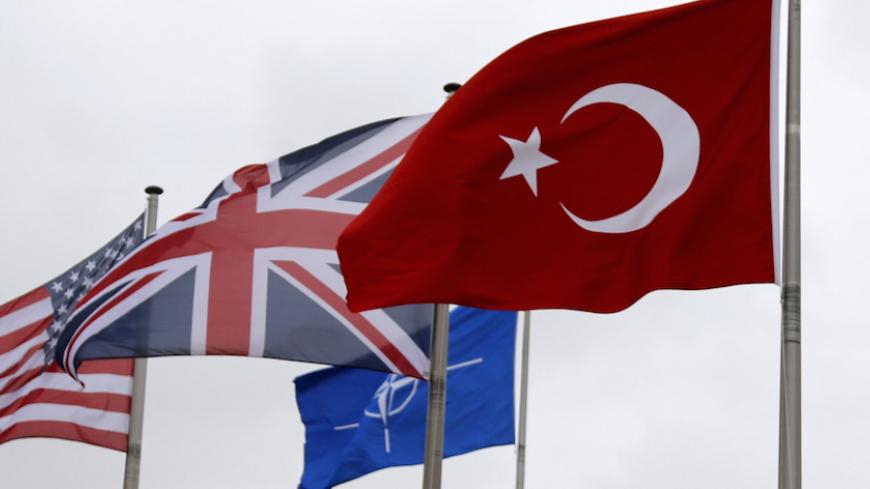 A Turkish flag (R) flies among others flags of NATO members during the North Atlantic Council (NAC) following Turkey's request for Article 4 consultations, at the Alliance headquarters in Brussels, Belgium, July 28, 2015. Turkey sought moral support for its campaign against militants in Syria and Iraq at an emergency meeting on Tuesday with its North Atlantic allies, with both NATO and Ankara playing down any idea of a call for military help from the alliance. Turkey requested urgent consultations with its 