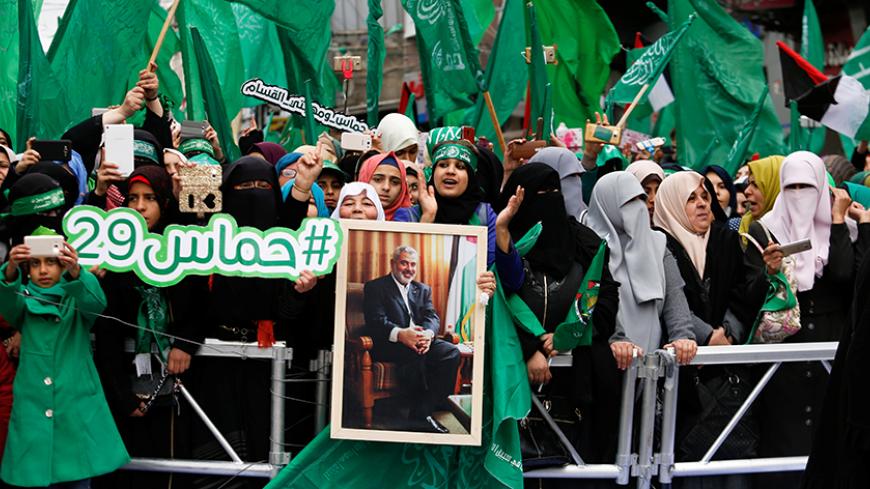 Palestinian Hamas supporters shout slogans during a rally marking the 29th anniversary of the founding of the Hamas movement, in Gaza city December 14, 2016. REUTERS/Suhaib Salem - RTX2UZFP