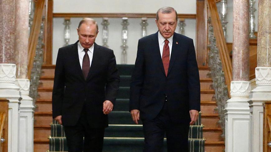 Russian President Vladimir Putin (L) and his Turkish counterpart Tayyip Erdogan arrive for a news conference following their meeting in Istanbul, Turkey, October 10, 2016. REUTERS/Osman Orsal     TPX IMAGES OF THE DAY      - RTSRP0B
