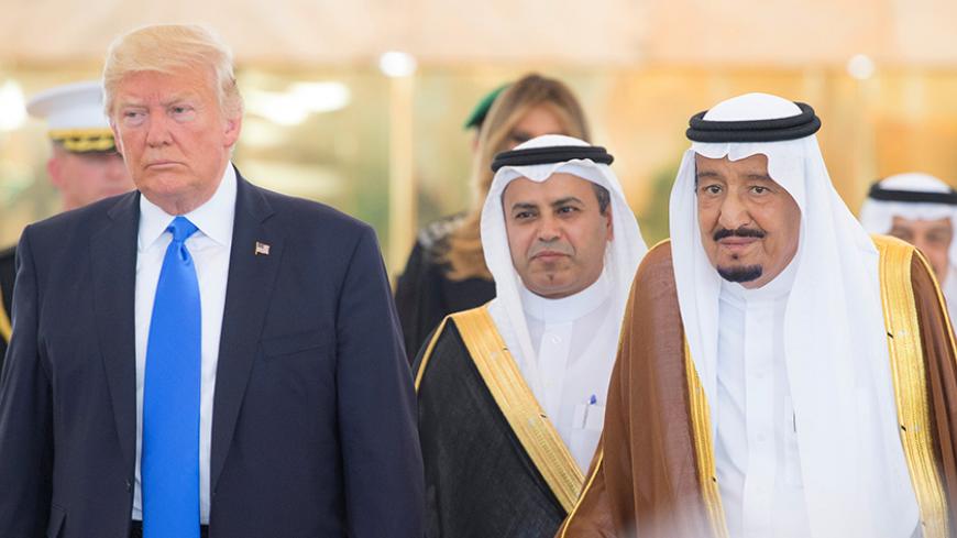 Saudi Arabia's King Salman bin Abdulaziz Al Saud stands next to U.S. President Donald Trump during a reception ceremony in Riyadh, Saudi Arabia, May 20, 2017. Bandar Algaloud/Courtesy of Saudi Royal Court/Handout via REUTERS ATTENTION EDITORS - THIS PICTURE WAS PROVIDED BY A THIRD PARTY. FOR EDITORIAL USE ONLY. - RTX36OPM