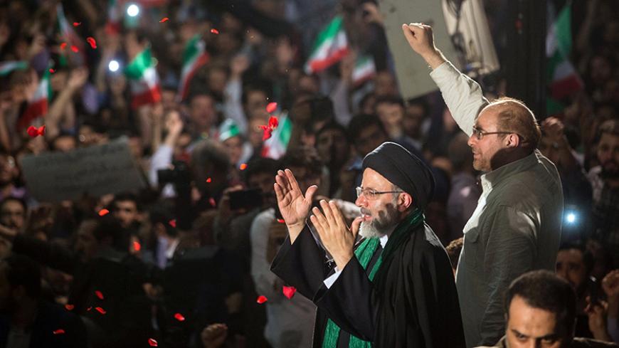 Iranian Presidential candidate Ebrahim Raisi (L) and Tehran Mayor Mohammad Baqer Qalibaf gesture during a campaign meeting at the Mosalla mosque in Tehran, Iran, May 16, 2017. Picture taken May 16, 2017. TIMA via REUTERS ATTENTION EDITORS - THIS IMAGE WAS PROVIDED BY A THIRD PARTY. FOR EDITORIAL USE ONLY. - RTX36CQS
