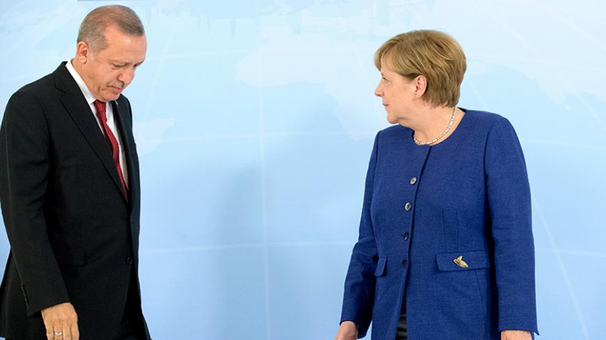 German Chancellor Angela Merkel meets Turkish President Recep Tayyip Erdogan on the eve of the G-20 summit in Hamburg, Germany, July 6, 2017. REUTERS/Michael Kappeler,POOL - RTX3ADT9