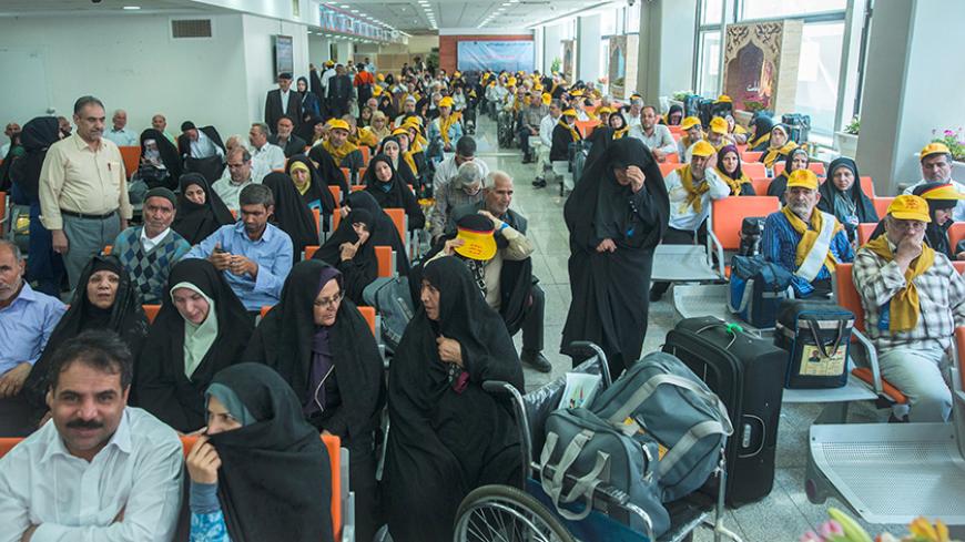 Iranian pilgrims wait at the Imam Khomeini airport in Tehran as they depart for the annual haj pilgrimage to the holy city of Mecca, in Tehran, Iran, July 31, 2017. Nazanin Tabatabaee Yazdi / TIMA via REUTERS. ATTENTION EDITORS ñ THIS IMAGE HAS BEEN SUPPLIED BY A THIRD PARTY. - RTS19T5G