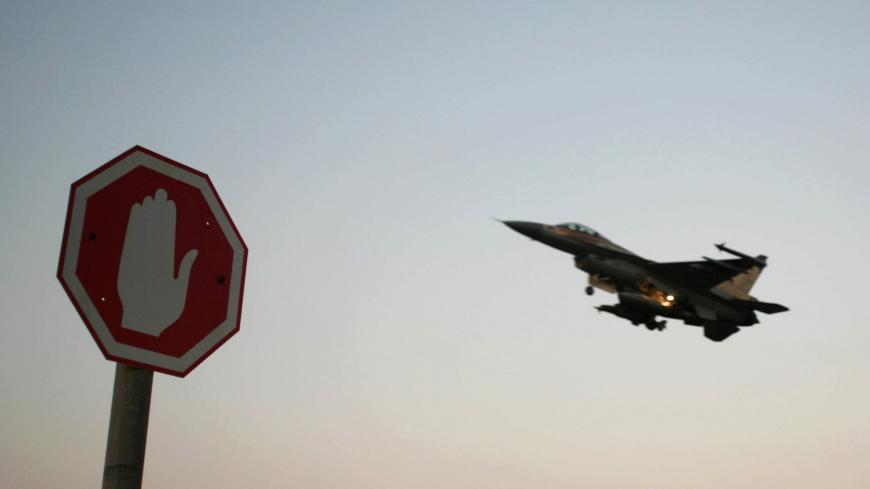 An Israeli Air Force F-16 fighter plane flies above a traffic sign after taking off for a mission in Lebanon from an Israeli Air Force Base in northern Israel July 20, 2006. Hizbollah fought fierce battles with Israeli troops on the Lebanese border on Thursday, as thousands more foreigners fled the nine-day-old war in Lebanon, including 1,000 Americans evacuated by U.S. Marines. REUTERS/Ammar Awad (ISRAEL) - GM1DTCAOOUAA
