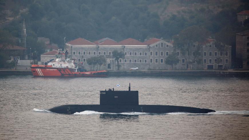 Russian Kilo-class diesel-electric submarine Krasnodar sets sail in the Bosphorus, on its way to the Black Sea during a hazy morning, in Istanbul, Turkey, August 7, 2017. REUTERS/Murad Sezer - RC1B0857E100