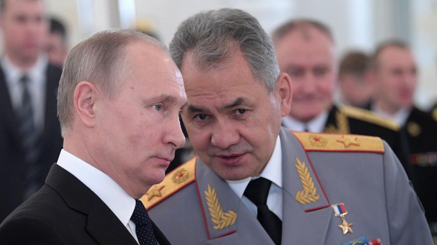 Russian President Vladimir Putin and Defence Minister Sergei Shoigu attend a state awards ceremony for military personnel who served in Syria, at the Kremlin in Moscow, Russia December 28, 2017. Sputnik/Alexei Druzhinin/Kremlin via REUTERS ATTENTION EDITORS - THIS IMAGE WAS PROVIDED BY A THIRD PARTY. - RC1FBBAD3FD0