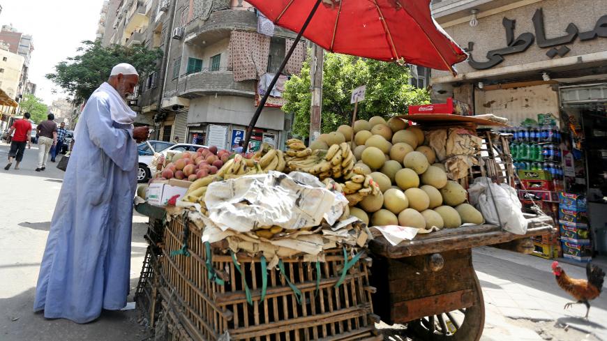 An Egyptian vegetable seller is seen at a market in Cairo, Egypt May 10, 2016. REUTERS/Mohamed Abd El Ghany - D1AETDGDRGAA