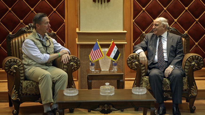 U.S. Representative Stephen Lynch (D-MA) (L) meets with Iraq's Deputy Foreign Minister Labid Abbawi (C) during his visit to Baghdad July 26, 2009. REUTERS/Hadi Mizban/Pool (IRAQ CONFLICT POLITICS) - GM1E57Q1IOY01
