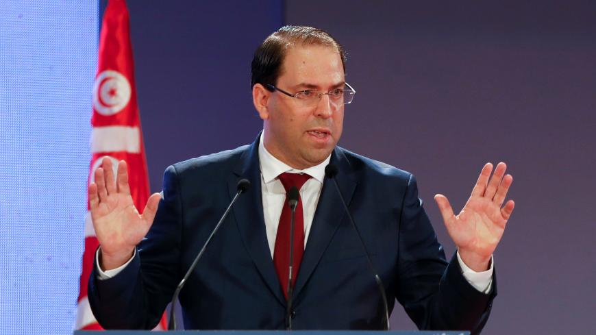 Tunisia's Prime Minister Youssef Chahed gestures as he speaks during a national conference over 2019 budget in Tunis, Tunisia, September 14, 2018. REUTERS/Zoubeir Souissi - RC1171513940