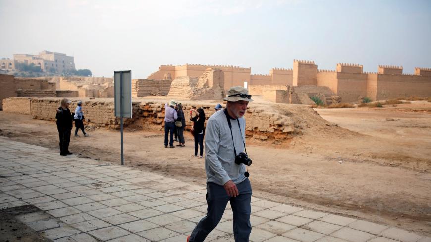 Foreign tourists visit the ancient city of Babylon near Hilla, south of Baghdad, Iraq November 14, 2018. Tourist agencies resumed work after the defeat of the Islamic state in Mosul. Picture taken November 14, 2018. REUTERS/Khalid al-Mousily - RC1E92A8FAA0