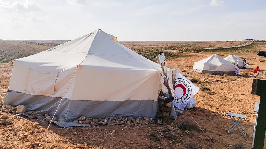 SYRIA - FEBRUARY 20, 2019: A humanitarian corridor for refugees leaving the Rukban refugee camp and 55-kilometre US-controlled Al-Tanf security zone in the settlement of Jabal al-Ghurab. Syria's law enforcement authorities and military police units of the Russian Armed Forces provide security at the two humanitarian corridors, Jleb and Jabal al-Ghurab. Konstantin Machulsky/TASS (Photo by Konstantin Machulsky\TASS via Getty Images)