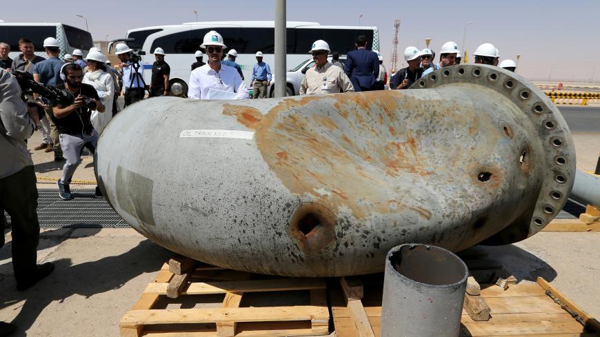 A damaged pipeline is seen at Saudi Aramco oil facility in Khurais, Saudi Arabia, September 20, 2019. REUTERS/Hamad l Mohammed - RC1220EF8C60