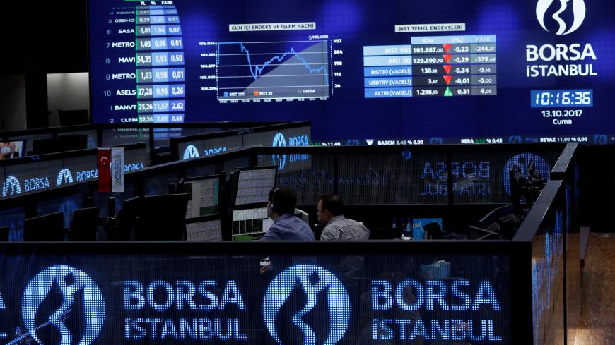 Traders work at their desks on the floor of the Borsa Istanbul in Istanbul, Turkey October 13, 2017. REUTERS/Murad Sezer - RC1141900C40