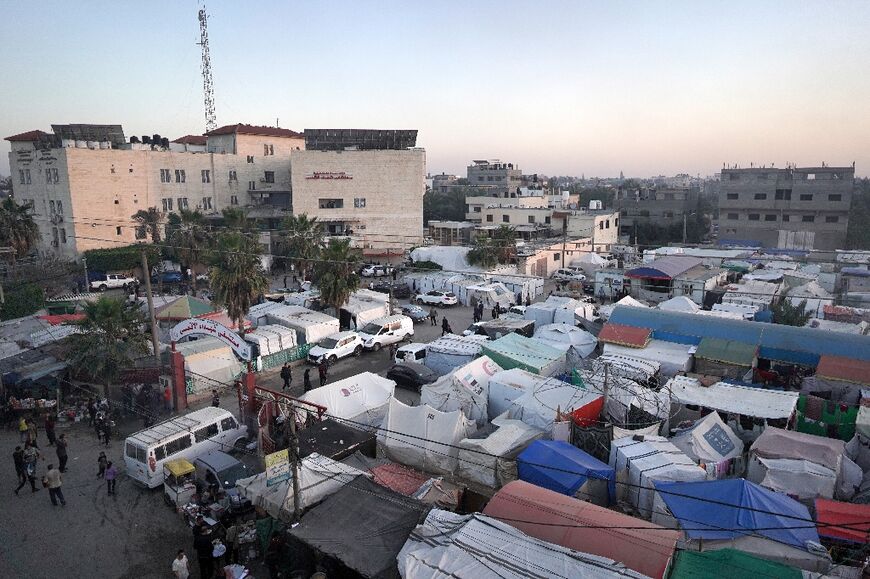 A makeshift tent city in Deir el-Balah -- Gazans say the beach is a welcome break from the crowded, sweltering shelters