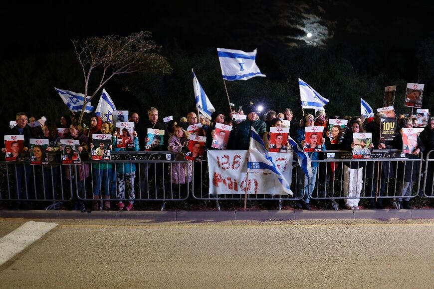 Protesters seeking a deal to free Israeli hostages protest outside Prime Minister Benjamin Netanyahu's private residence in Caesarea north of Tel Aviv on January 27, 2024