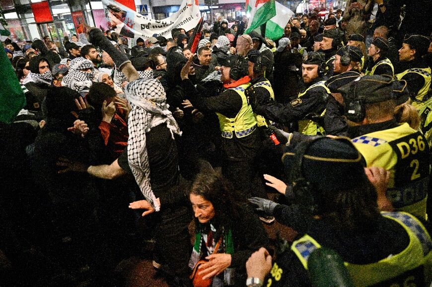 Police face pro-Palestinian protesters in central Malmo during the Eurovision Song Contest 