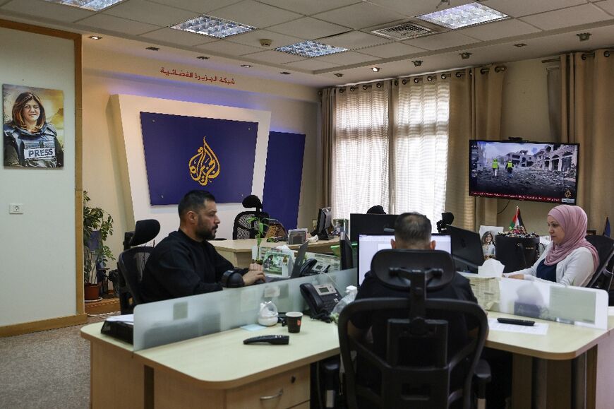 Al Jazeera employees at the broadcaster's offices in Ramallah in the occupied West Bank