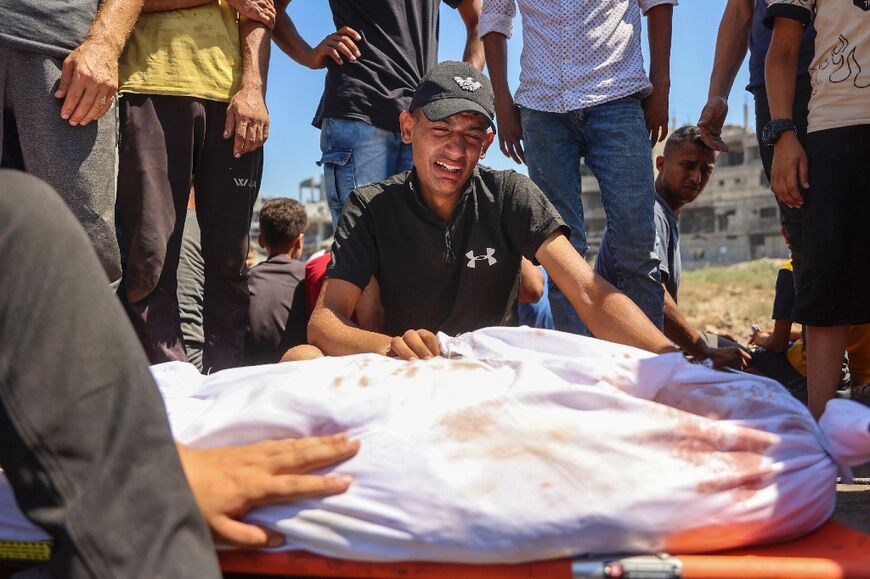 Relatives mourn loved ones killed during Israeli bombardment in the al-Tuffah neighbourhood in Gaza City on June 22, 2024