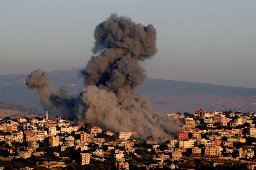 Black smoke billows following an Israeli air strike that targeted a house in the southern Lebanese village of Khiam  on June 21, 2024